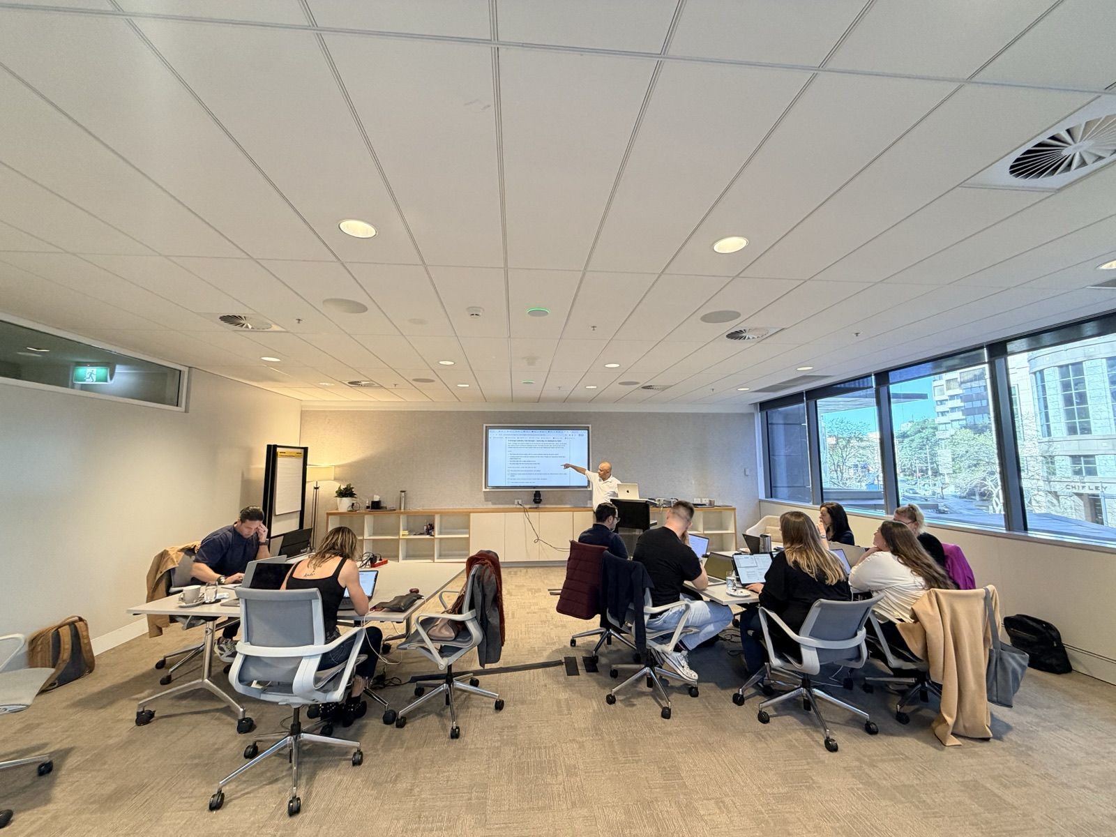 The Sydney retreat room, Dave Hajdu at the screen and the group at work